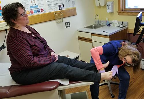A clinician treats a patient with diabetes